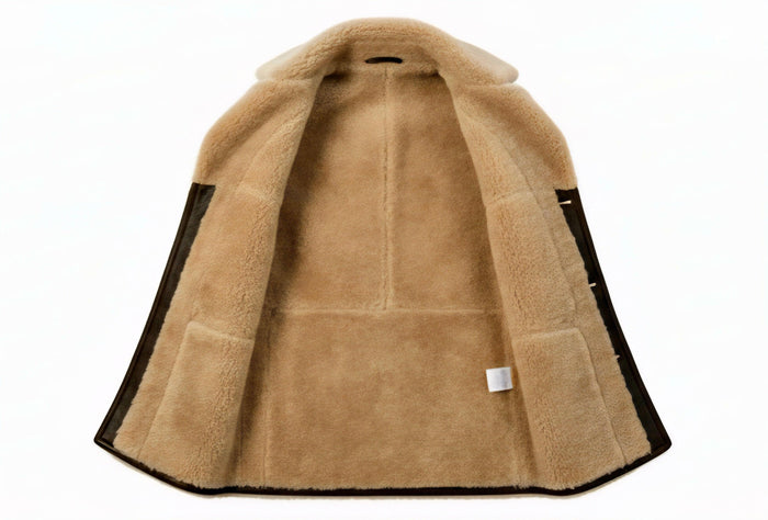 Close-up of the 100% Merino sheepskin lining in taupe, showing the authentic texture and high-quality Italian tailoring.