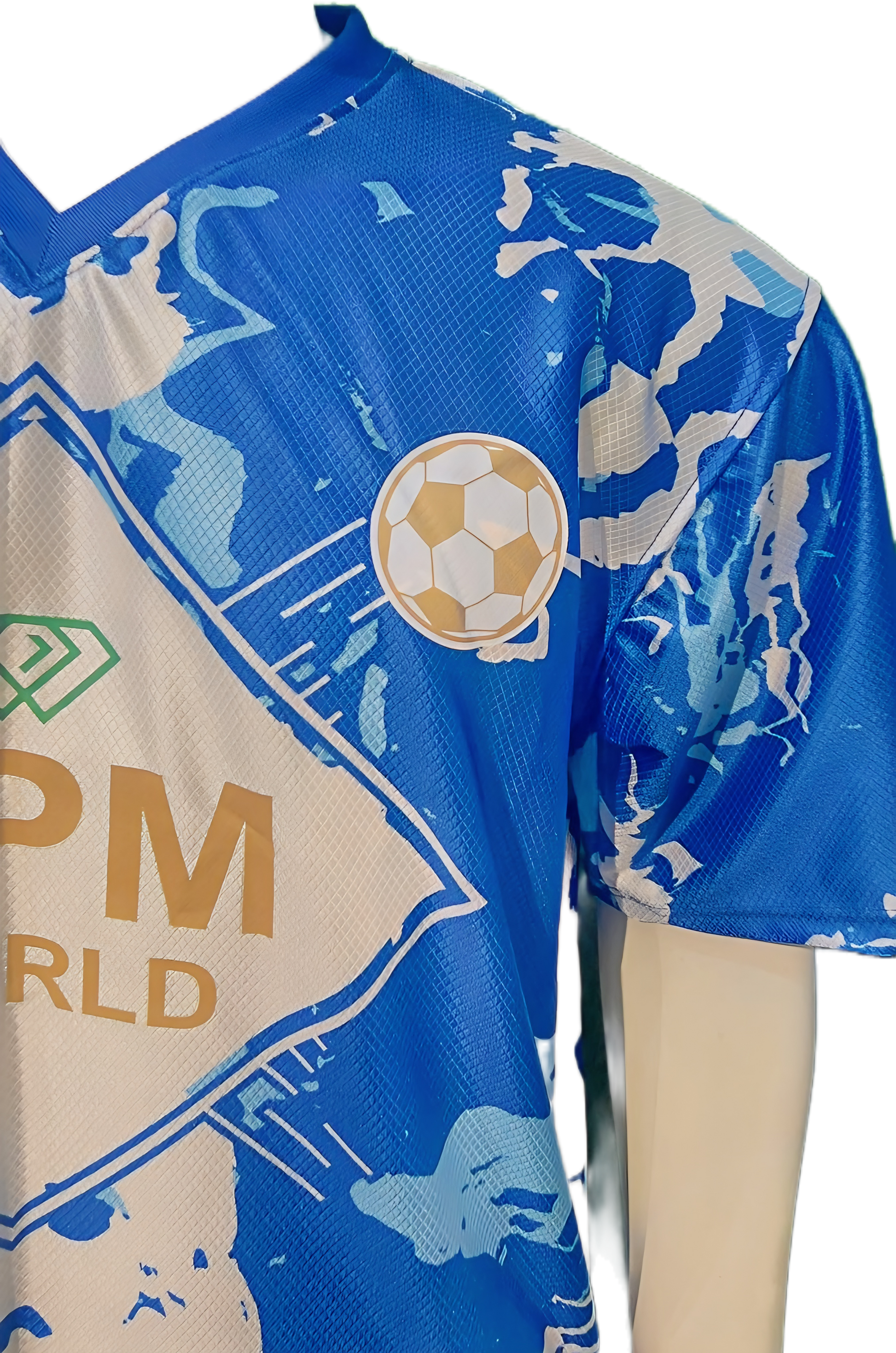 Close-up of OPM World gold logo and green diamond crest on professional-grade football kit.