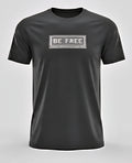 Black t-shirt with 'BE FREE' text on a gray background