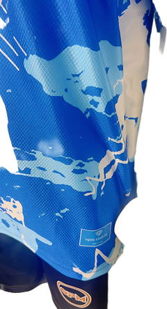 Macro shot of breathable performance fabric and OPM circular patch on a bespoke football top.