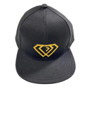 Gray cap with yellow logo on a textured white surface