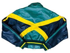 Green and navy leather jacket with yellow accents on a gray surface