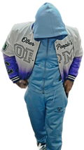 Person wearing a blue tracksuit with a blurred background