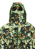 Camouflage-patterned jacket with a hood on a beige background