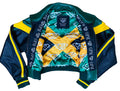 Colorful jacket with geometric patterns and 'OPM' branding on a gray surface