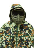 Person wearing a camouflage jacket and mask on a beige background