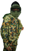 Person wearing a camouflage outfit with a green mask on a gray background