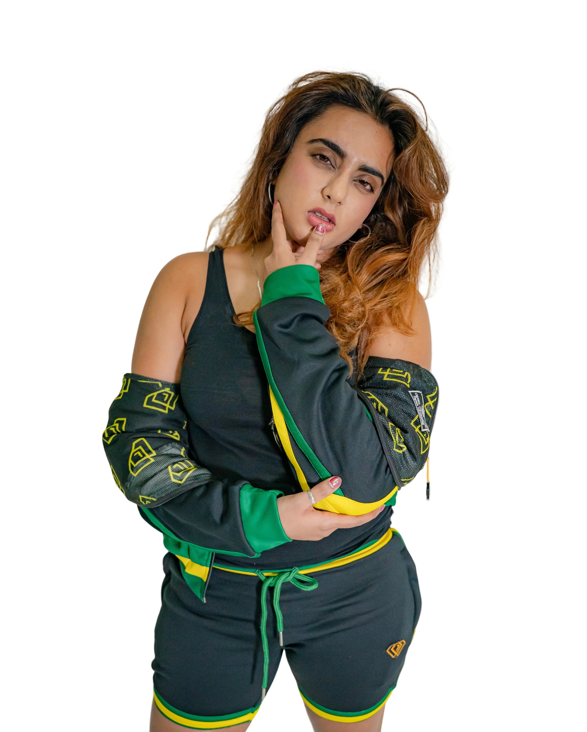 Woman wearing a green and black outfit with yellow accents against a white background