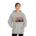 Woman in grey streetwear hoodie with colorful graphic and 'Other peoples Money' text