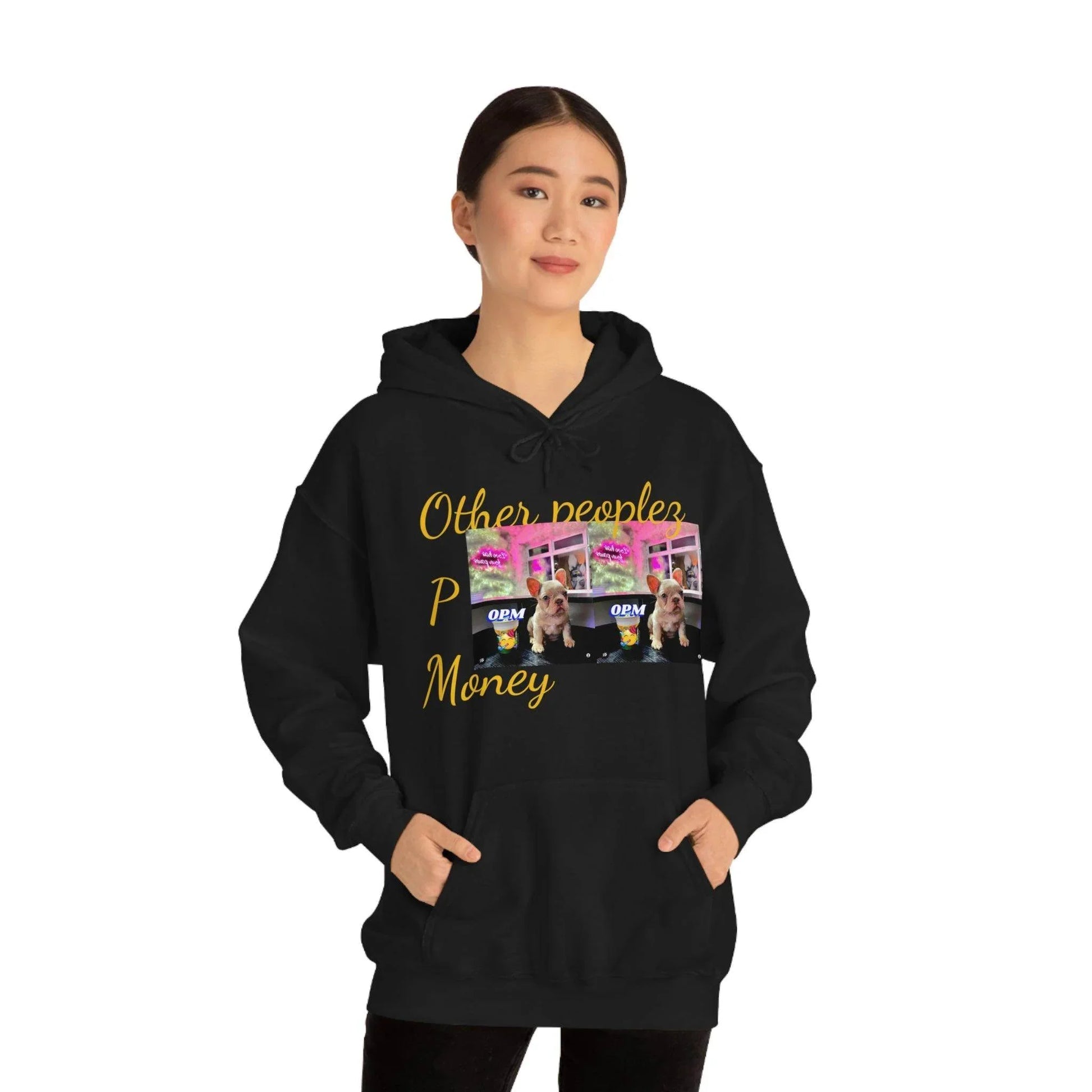 Woman wearing black hoodie with 'Other peoples Money' gold text and dog graphic print