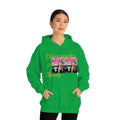 Woman wearing green hoodie with 'Other peoples Money' text and dog photo print, streetwear style
