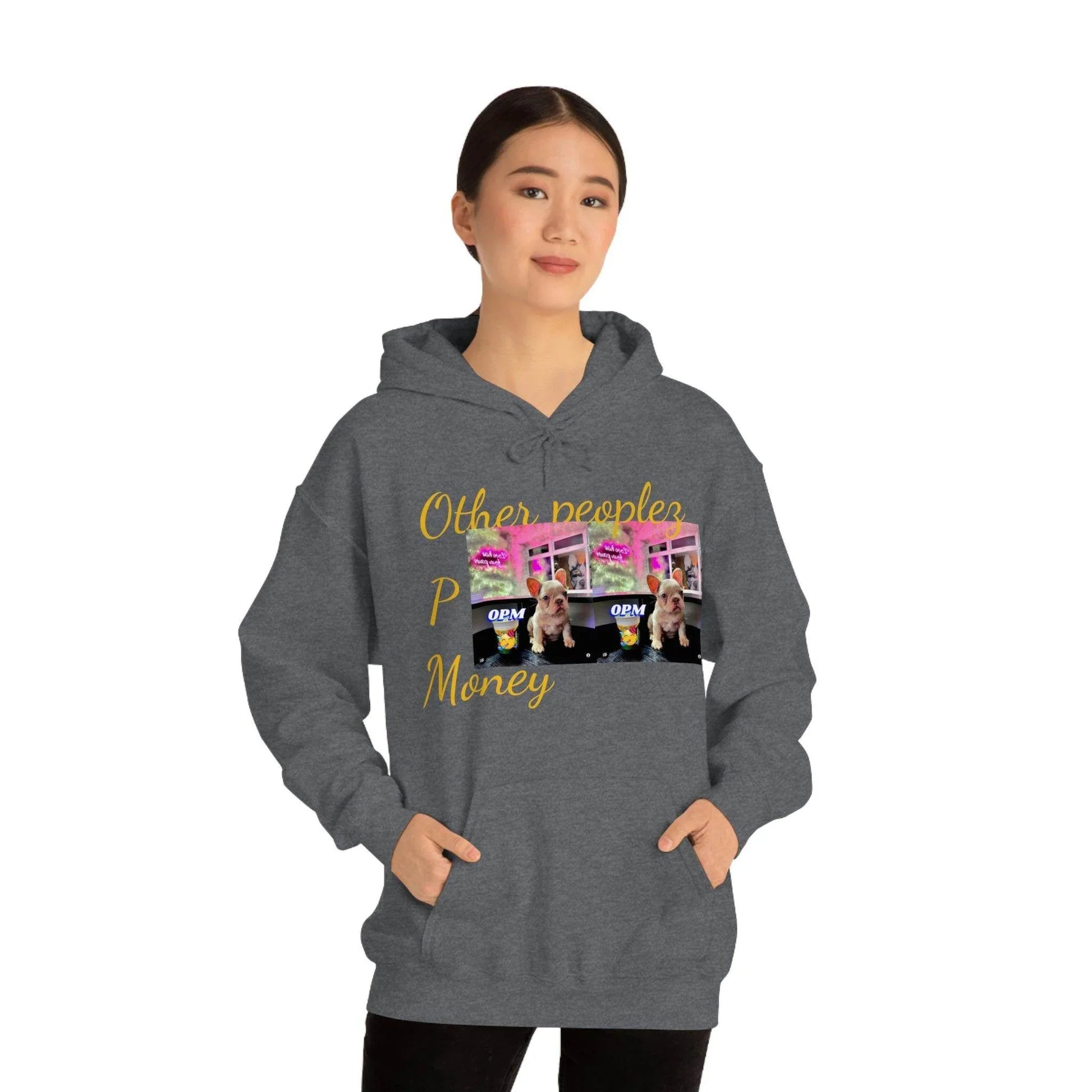 Woman wearing dark gray hoodie with yellow 'Other peoples Money' text and dog graphic design