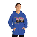 Woman wearing royal blue hoodie with 'Other peoples Money' and dog graphic print, urban streetwear