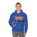 Man wearing blue graphic hoodie with 'Other peoples Money' text and dog print, urban streetwear