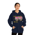 Woman wearing navy blue hooded sweatshirt with 'Other peoples Money' graphic and dog print