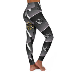 High-waisted black and grey graphic print leggings featuring abstract face and script accents