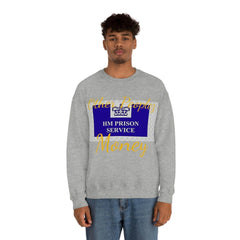 Man wears grey crewneck sweatshirt with HM Prison Service and gold Other Peoples Money text