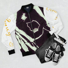 Men's black and white graphic bomber jacket with yellow script, styled with jeans and sneakers.