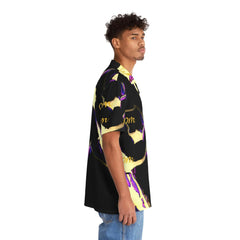Man wearing black and yellow Hawaiian shirt with graphic pattern, side view, casual style