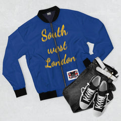 Blue bomber jacket with 'South west London' gold script, paired with black jeans and sneakers