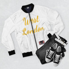 White bomber jacket with 'West London' gold text, black collar, paired with jeans and sneakers