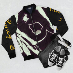 Bomber jacket with bold black and white abstract graphic, yellow script on sleeves, styled with jeans and sneakers