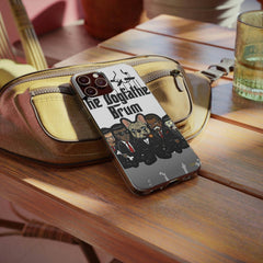 Cartoon dog mafia graphic soft phone case on brown bag, wooden table, modern streetwear accessory