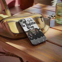 Cartoon dog and men in suits on 'The Dogfather Brum' phone case, resting on a bag.