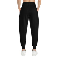 Back view of black jogger pants with elastic waistband and cuffs, styled for streetwear.