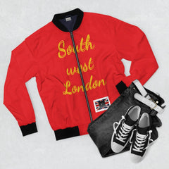 Red bomber jacket with 'South west London' in yellow, black collar, paired with jeans and sneakers