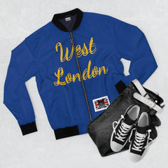 Blue bomber jacket with 'West London' text, paired with jeans, white belt, and sneakers