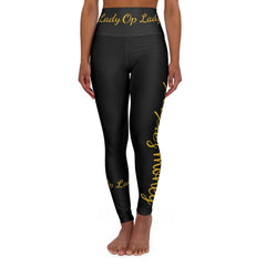 Black high-waisted leggings with gold script text, modeled on a white background
