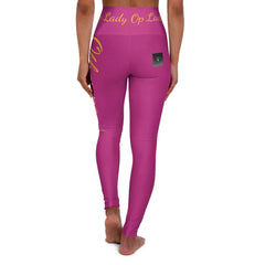 Woman wearing high-waisted pink yoga leggings with yellow script and logo detail on waistband