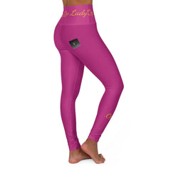 Woman wearing pink high-waisted yoga leggings with yellow script and barefoot on white background