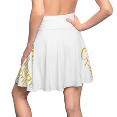 White women's skater skirt with gold script designs, shown from the back on a model