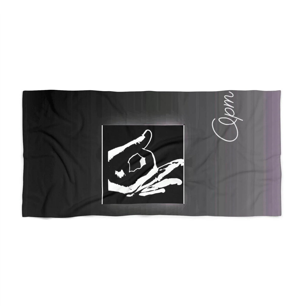 Black beach towel with bold white hand sign graphic and cursive 'Opm' lettering