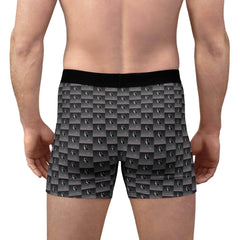 Back view of a man wearing black and grey patterned boxer briefs with logo design