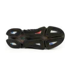 Black mesh sneaker sole with geometric tread pattern and colorful accents, urban footwear