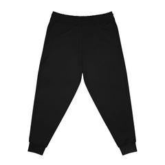 Black jogger pants with elastic waistband and tapered cuffs, rear view, streetwear style