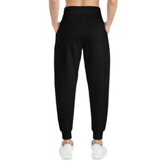 Back view of black jogger pants with elastic waistband, styled for urban streetwear