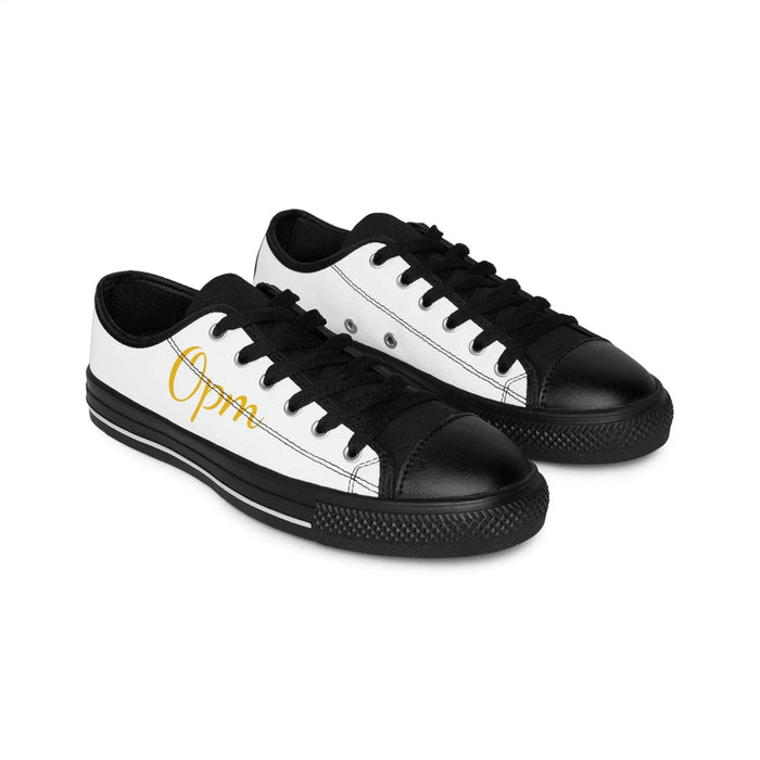 Black and white low-top sneakers with yellow 'Opm' script on the side, urban streetwear style
