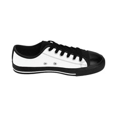 Black and white low-top sneaker with black laces and rubber sole, side view