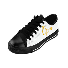 White and black low-top sneaker with yellow 'Opm' text, urban streetwear style