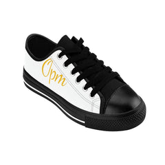 White and black low-top sneaker with "Opm" gold script on side, urban streetwear shoe