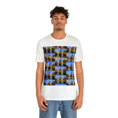 Man wearing white short sleeve tee with urban scenic graphic and gold script, casual streetwear