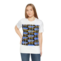 Woman wearing white streetwear t-shirt with graphic print and gold script text