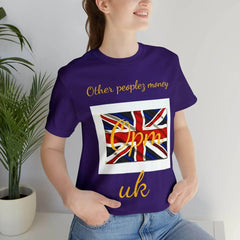 Woman wearing purple t-shirt with Union Jack design and gold text 'Other peoplez money Opm uk'.