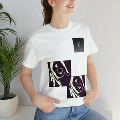 Woman wearing white unisex short sleeve tee with bold abstract hand graphics, urban streetwear style