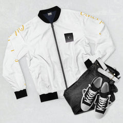 White bomber jacket with black collar, dark jeans, white belt, and black sneakers