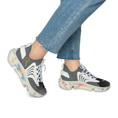 Women's mesh sneakers with white and gray design, clear multicolor sole, paired with jeans